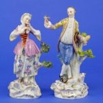 two damaged figurines