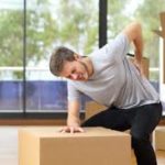 A man who injured his back while moving boxes
