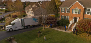 House with a United Van Lines moving truck in the driveway.