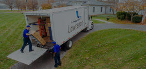 Overhead view of a Lawrence Moving tuck backed up into a driving with mover loading boxes