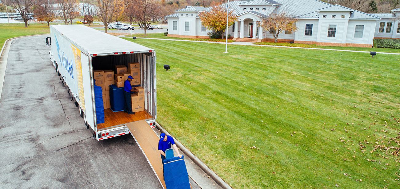 Two movers unloading a truck