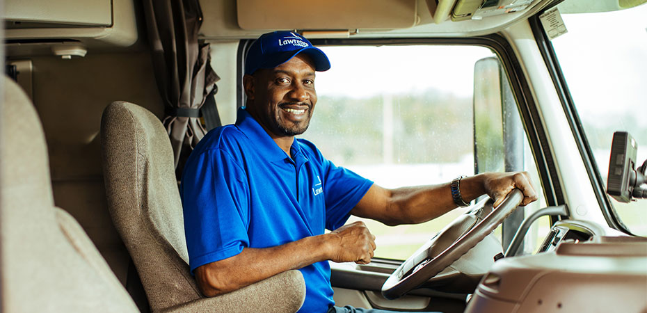 A Lawrence Moving driver sitting in his truck.