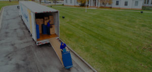 Mover unloading a united van lines moving truck.