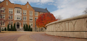 A college university with a building in the background.