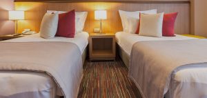 A hotel room with two beds.