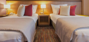 A hotel room with two beds.