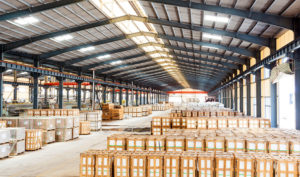 An industrial warehouse with lots of boxes.