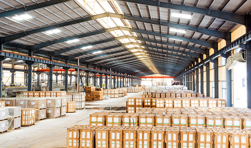 An industrial warehouse with lots of boxes.