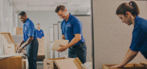 Office movers unpacking boxes.