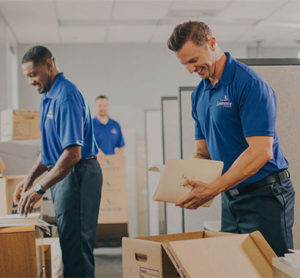 Office movers unpacking boxes.