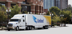 United Van Lines moving truck in front of a building.