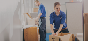 Office movers unpacking boxes.