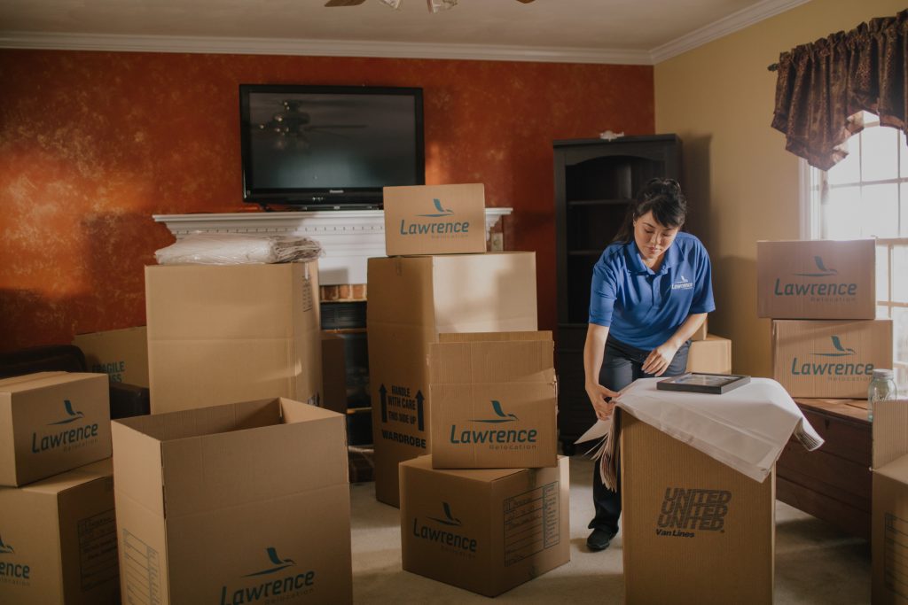 moving woman packing boxes