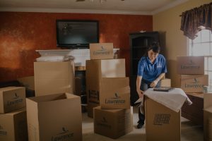 woman moving company packing boxes