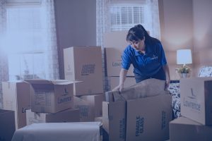 woman packing boxes for a moving company