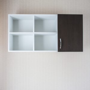 wood cabinet on the wall of a bathroom