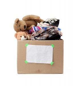 rown cardboard box with things, toys isolated on white background, concept of moving, volunteering and help