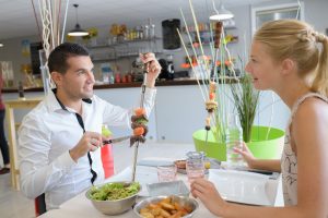 Man and woman at a table of a nice restaurant