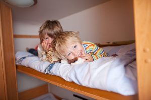 Kids happy sharing a bunk bed
