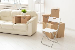 Moving boxes in a fresh, bright apartment.