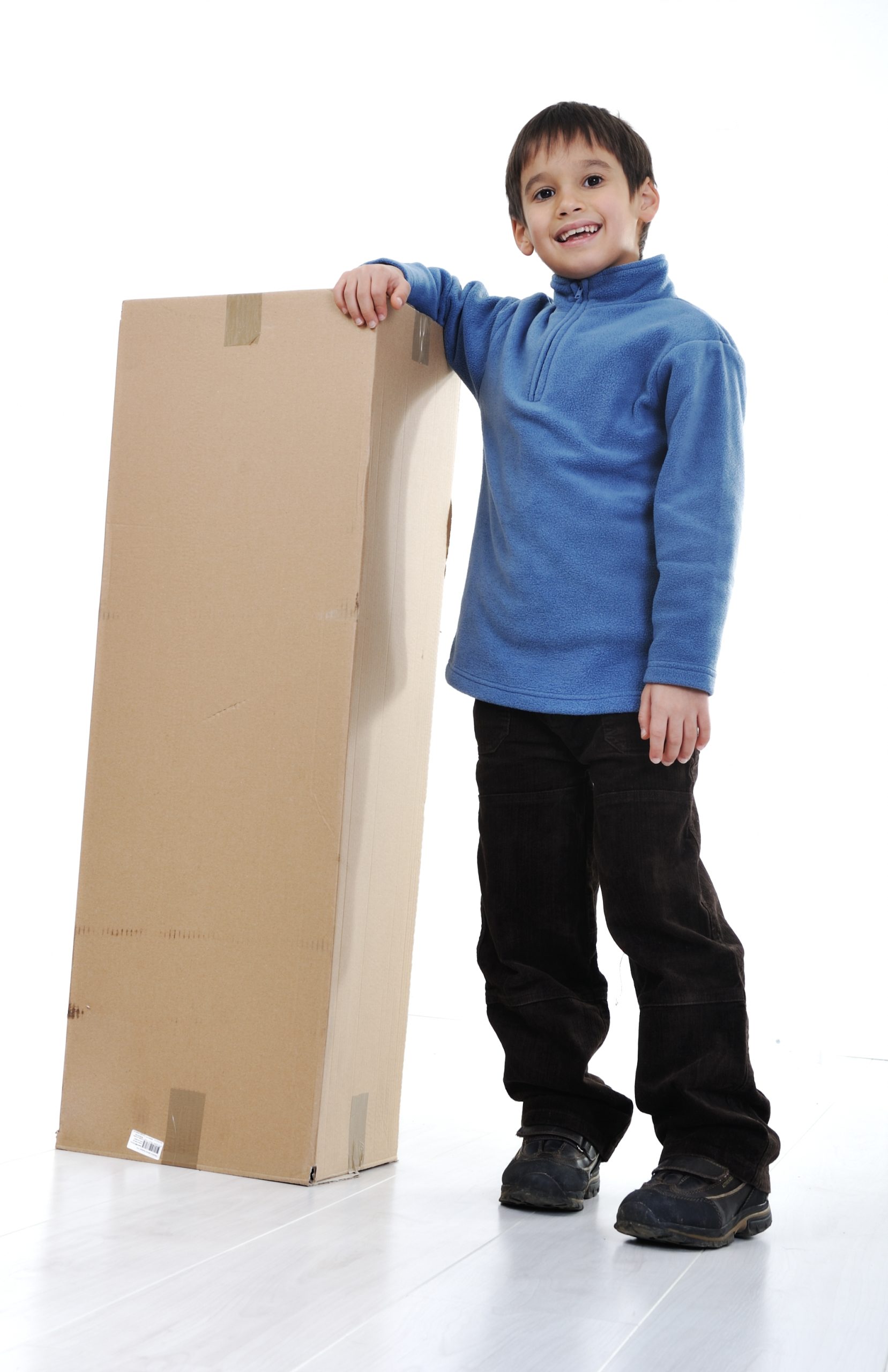Young child with moving carton box