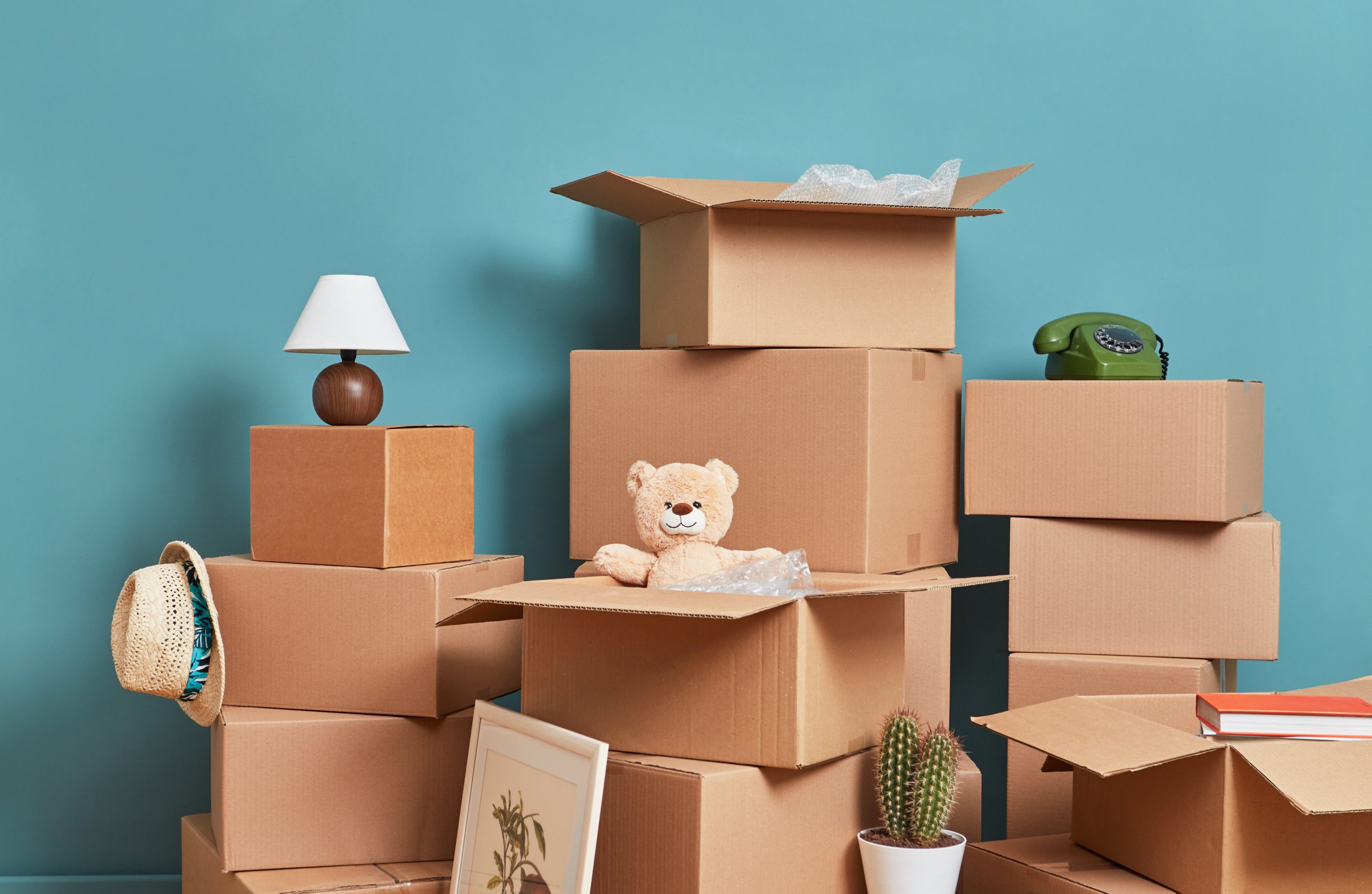 Cardboard boxes and belongings in room